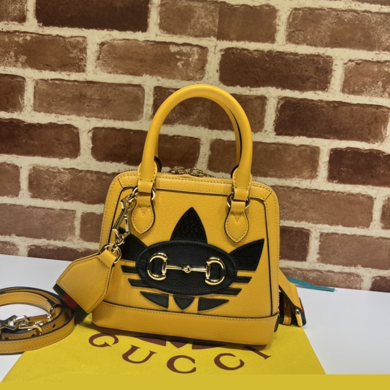 G*u*i top handle bags